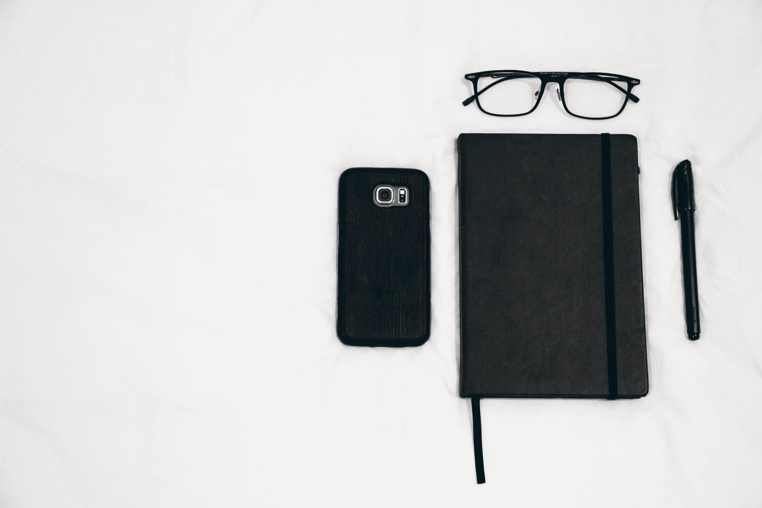 Tools of the Trade: glasses, phone, notebook, pen. computer not included.